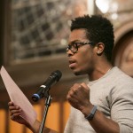 Rajah Reid, A15, performs a spoken word response at the University Chaplain's office Dr. Martin Luther King Jr. Day Community Celebration at Goddard Chapel on Jan. 22, 2015. Rajah Reid, A15, performs a spoken word response at the University Chaplain's office Dr. Martin Luther King Jr. Day Community Celebration at Goddard Chapel on Jan. 22, 2015.