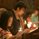 Attendees pause for a moment of silence during a candlelight vigil at the University Chaplain's office Dr. Martin Luther King Jr. Day Community Celebration at Goddard Chapel on Jan. 22, 2015. Attendees pause for a moment of silence during a candlelight vigil at the University Chaplain's office Dr. Martin Luther King Jr. Day Community Celebration at Goddard Chapel on Jan. 22, 2015.