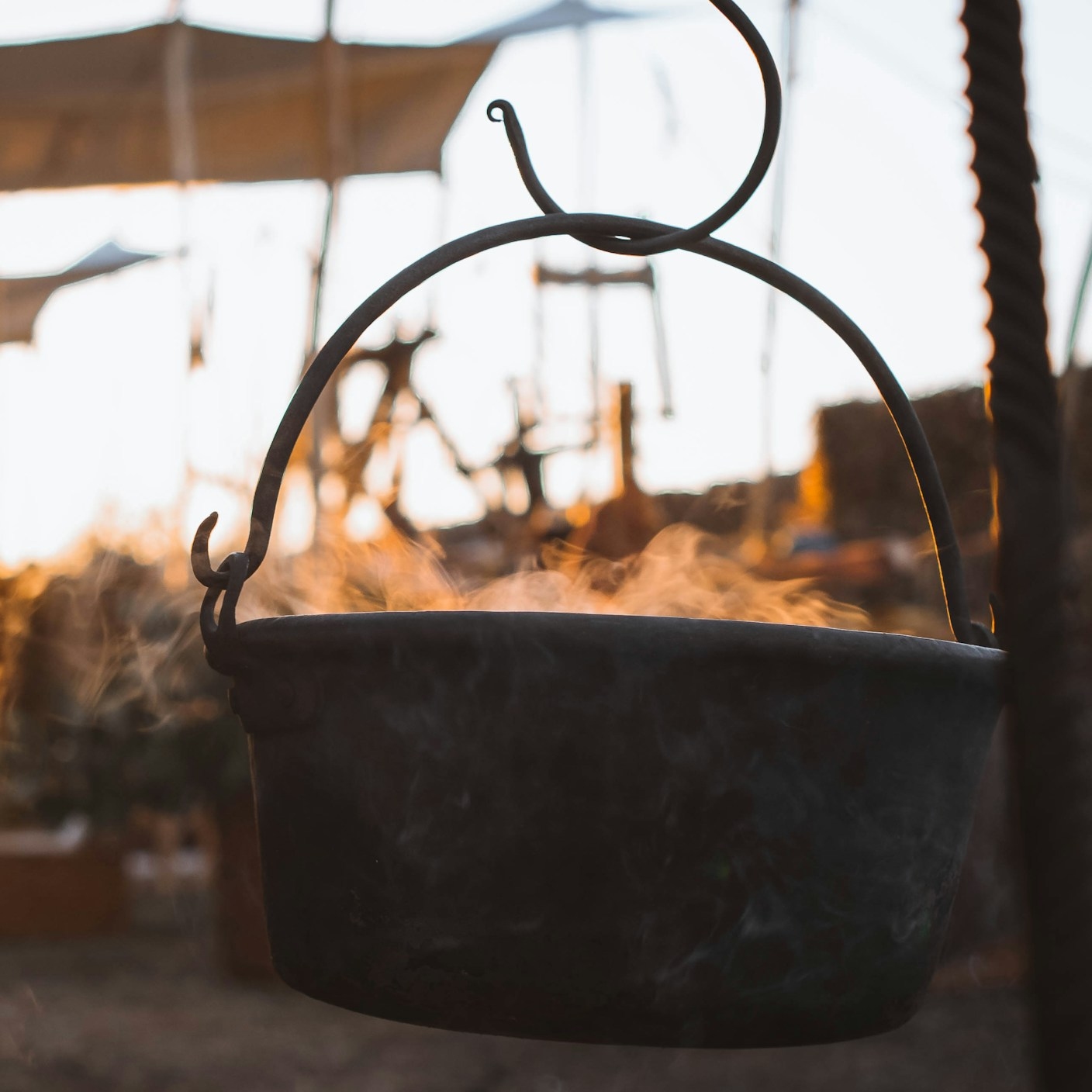 A large metal pot on a hook